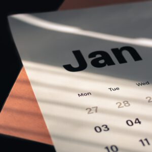a calendar sitting on top of a wooden table